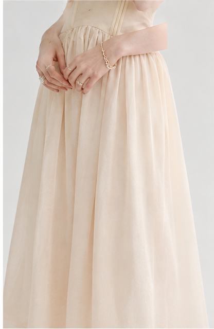 Light peach-colored spaghetti strap lace-trimmed long dress