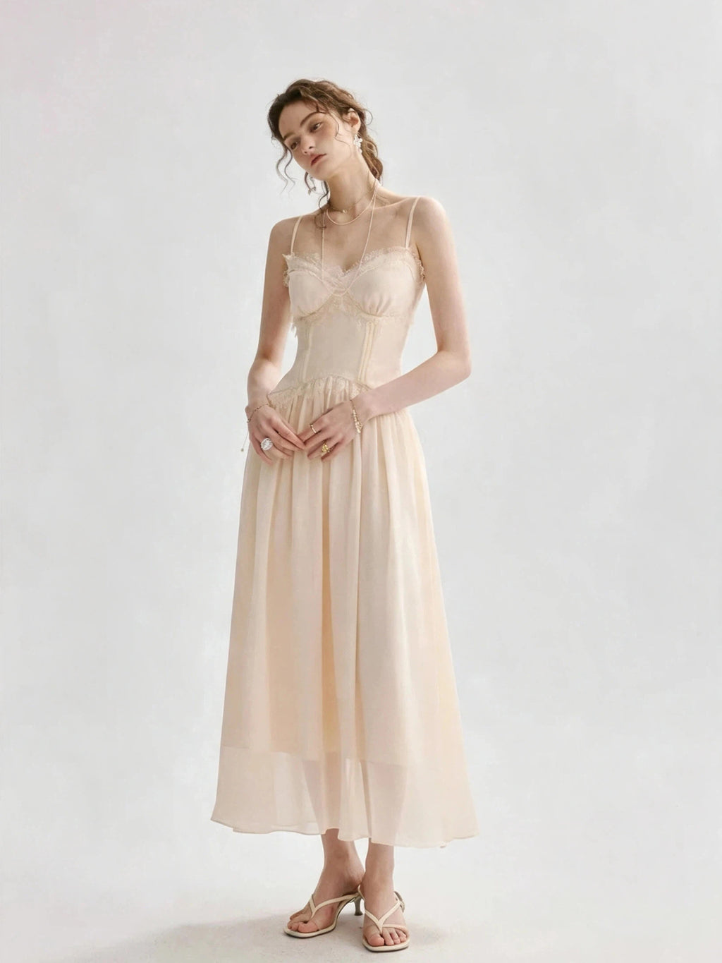 Light peach-colored spaghetti strap lace-trimmed long dress
